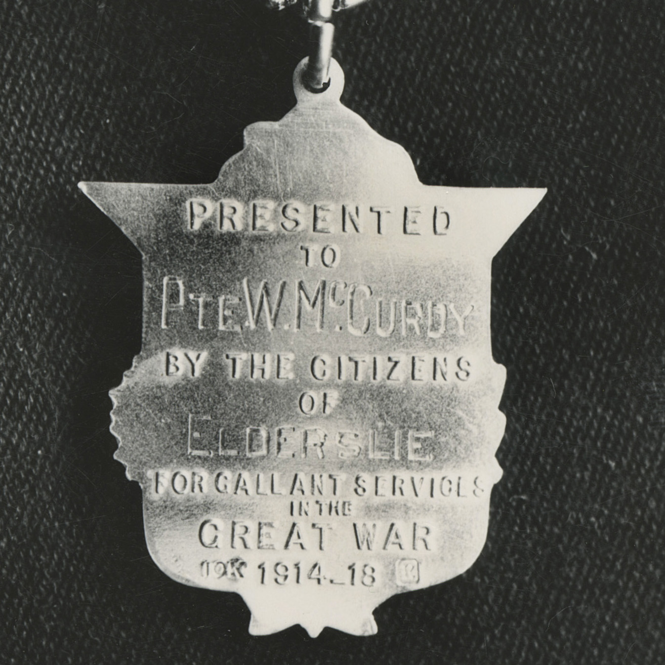 A2020.080.003, Pte. W. McCurdy shield necklace